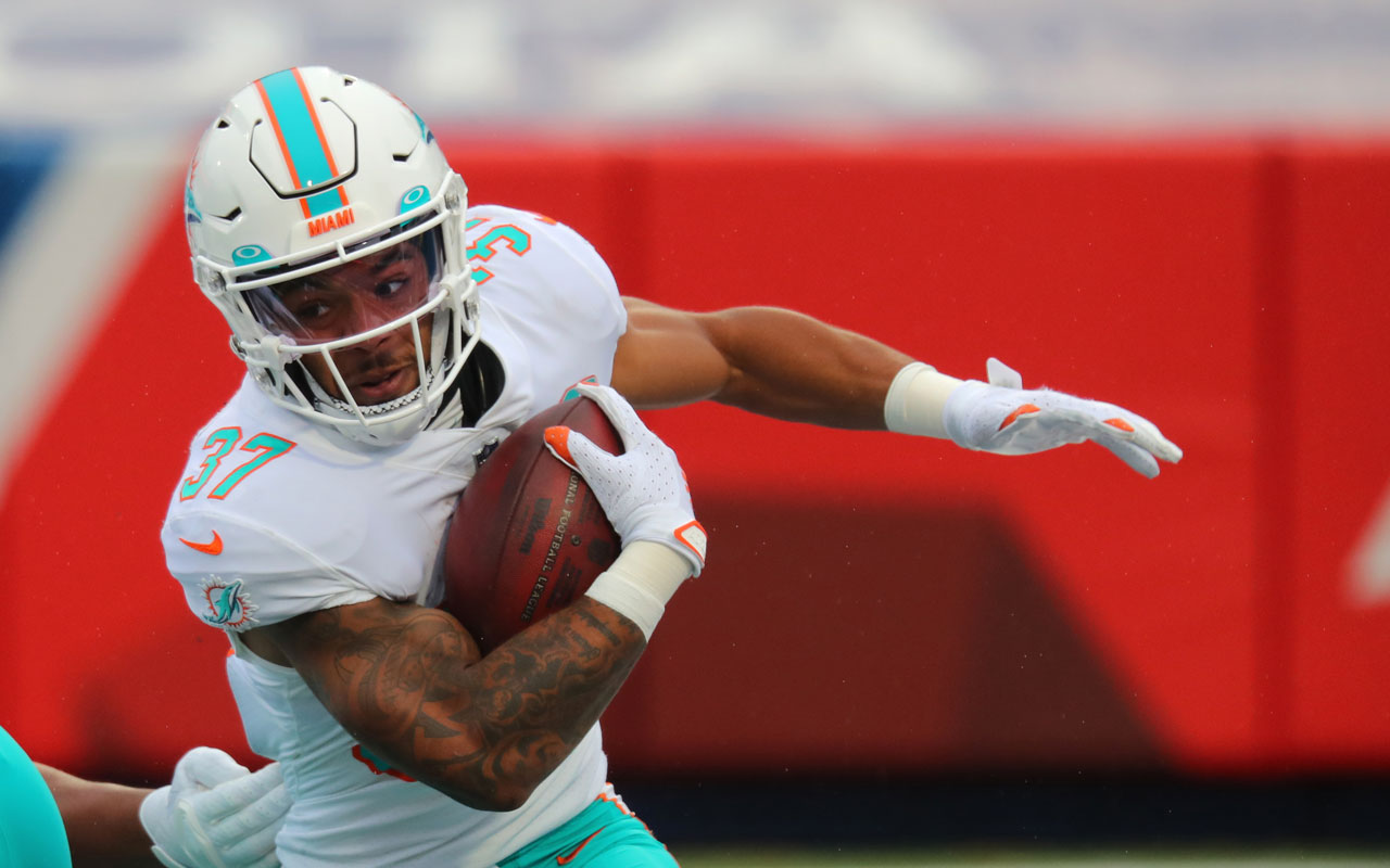 Miami Dolphins running back Myles Gaskin (37) is tackled by