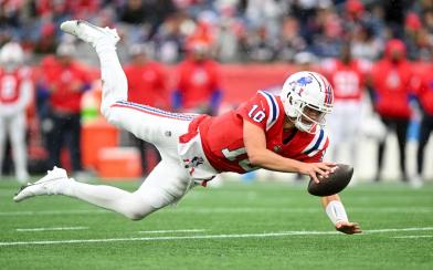 Drake Maye diving for first down 