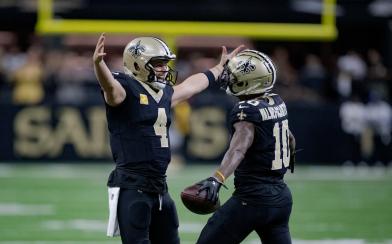 Marques-Valdes Scantling and Derek Carr hugging 